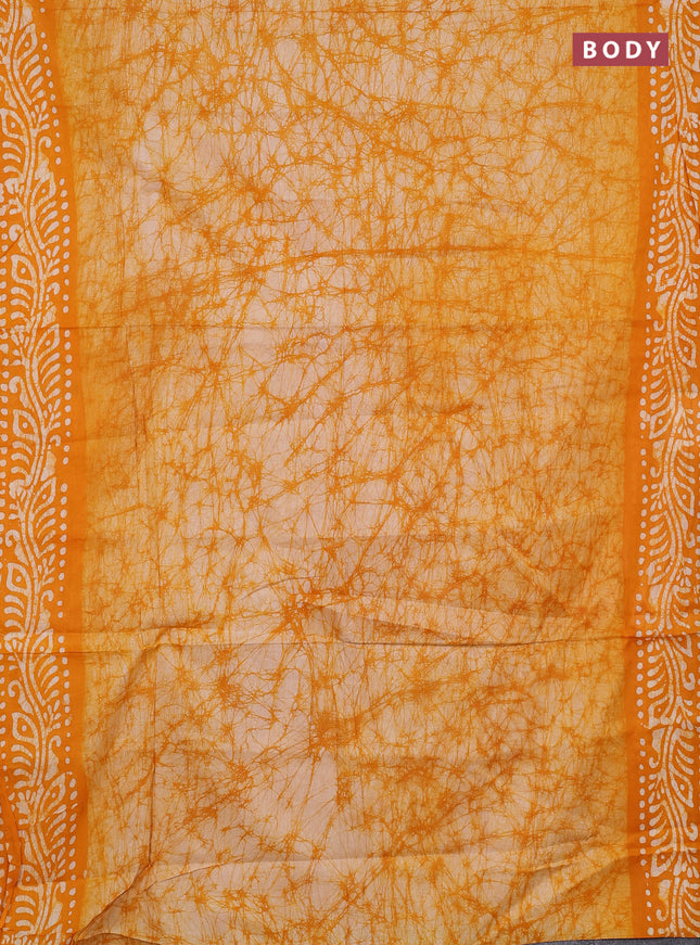 Batik cotton saree mango yellow with allover prints and batik printed border
