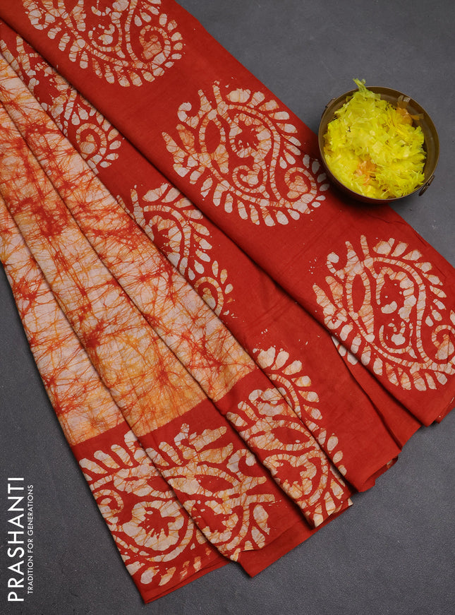 Batik cotton saree rust shade with allover prints and batik printed border