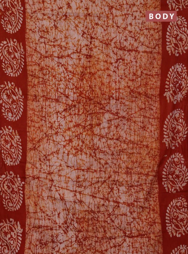 Batik cotton saree rust shade with allover prints and batik printed border