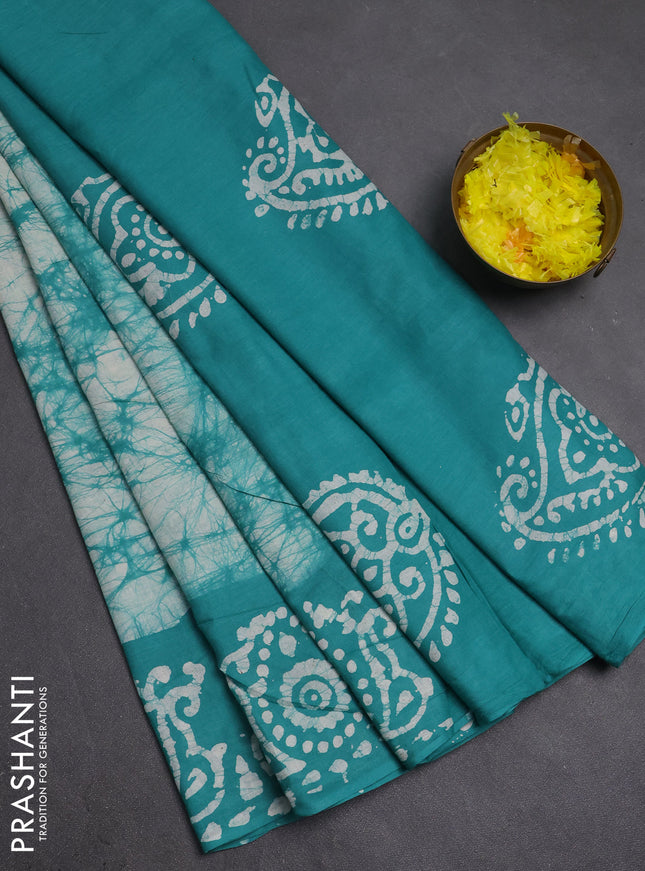 Batik cotton saree teal green with allover prints and batik printed border