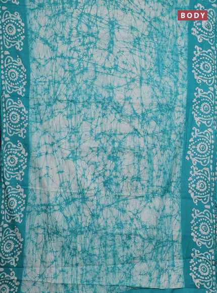 Batik cotton saree teal green with allover prints and batik printed border