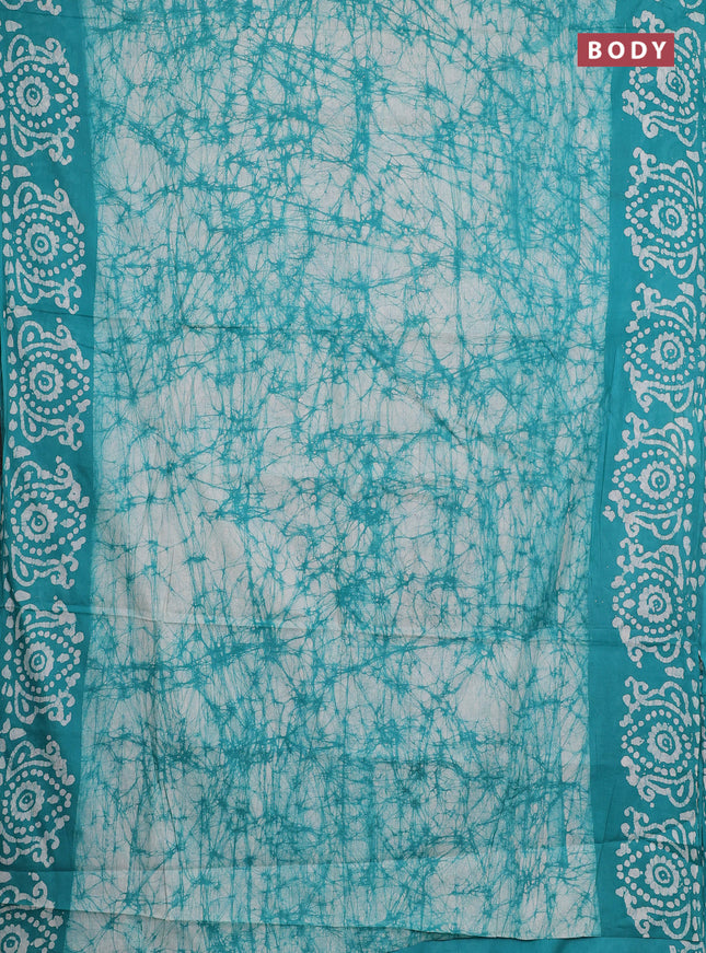 Batik cotton saree teal green with allover prints and batik printed border