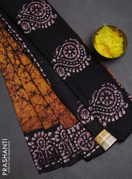 Batik cotton saree mango yellow and jamun shade with allover prints and batik printed border