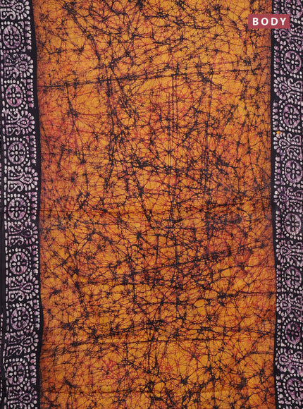 Batik cotton saree mango yellow and jamun shade with allover prints and batik printed border