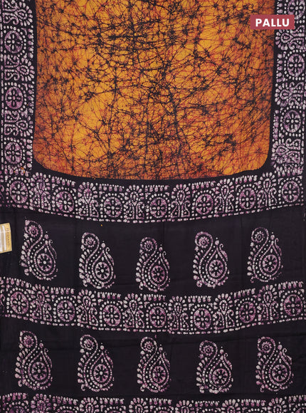 Batik cotton saree mango yellow and jamun shade with allover prints and batik printed border
