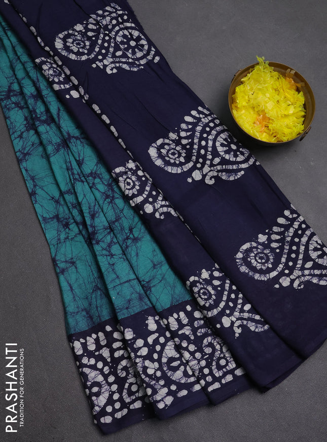 Batik cotton saree green and navy blue with allover prints and batik printed border
