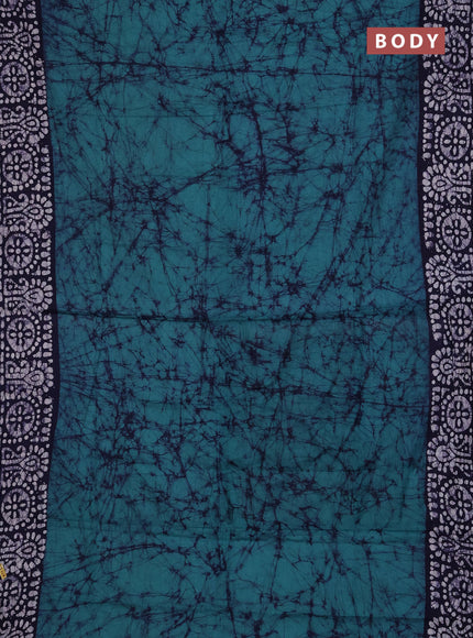 Batik cotton saree green and navy blue with allover prints and batik printed border