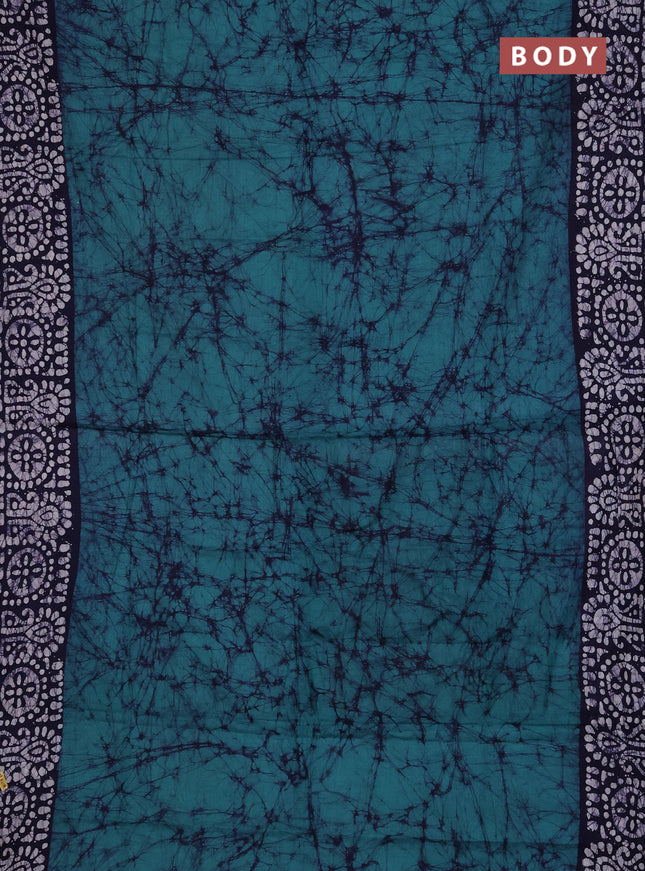 Batik cotton saree green and navy blue with allover prints and batik printed border