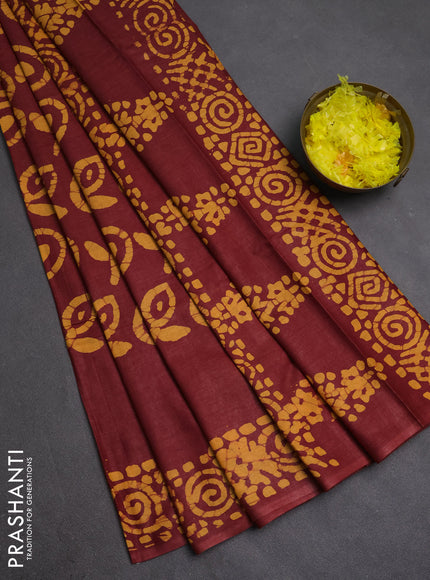 Batik cotton saree maroon with allover prints and batik printed border