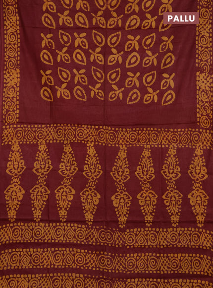 Batik cotton saree maroon with allover prints and batik printed border