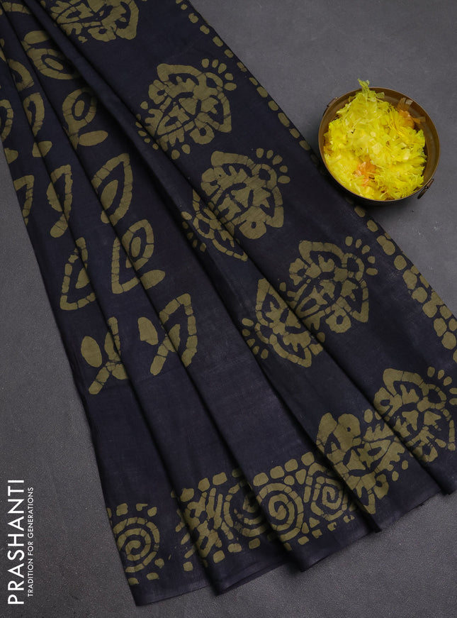 Batik cotton saree black with allover prints and batik printed border