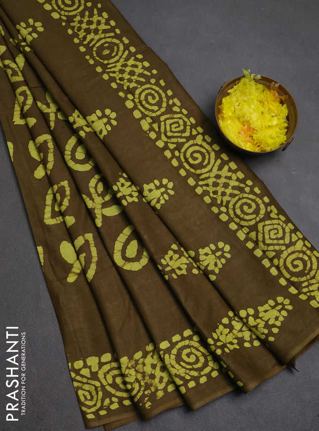 Batik cotton saree mehendi green with allover prints and batik printed border
