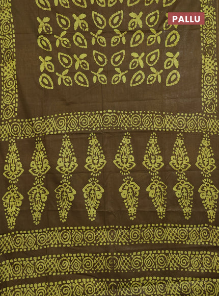 Batik cotton saree mehendi green with allover prints and batik printed border