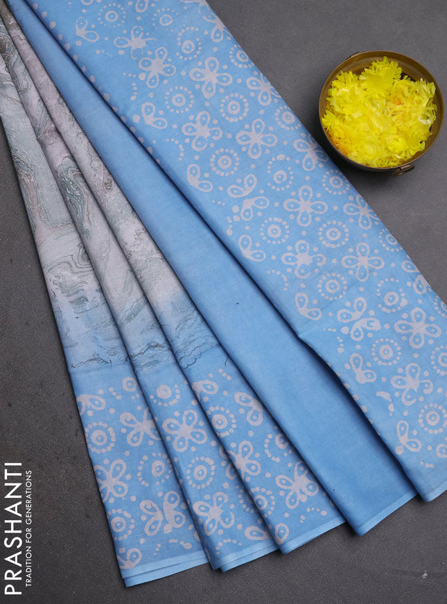 Batik cotton saree multi colour and pastel blue with allover prints and batik printed border