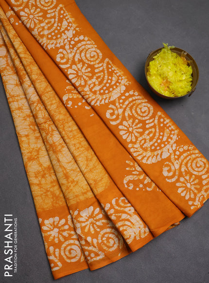 Batik cotton saree mango yellow with allover prints and batik printed border