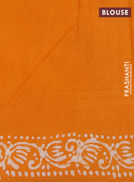 Batik cotton saree mango yellow with allover prints and batik printed border