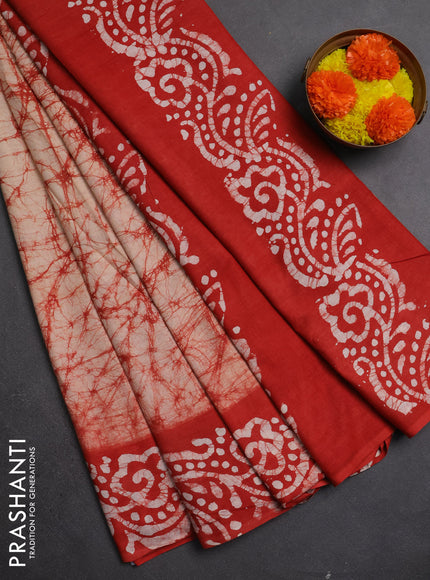 Batik cotton saree beige and red with allover prints and batik printed border