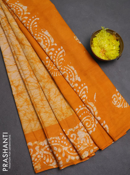 Batik cotton saree mango yellow with allover prints and batik printed border