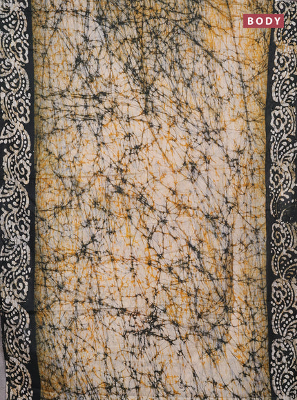 Batik cotton saree beige and black with allover prints and batik printed border