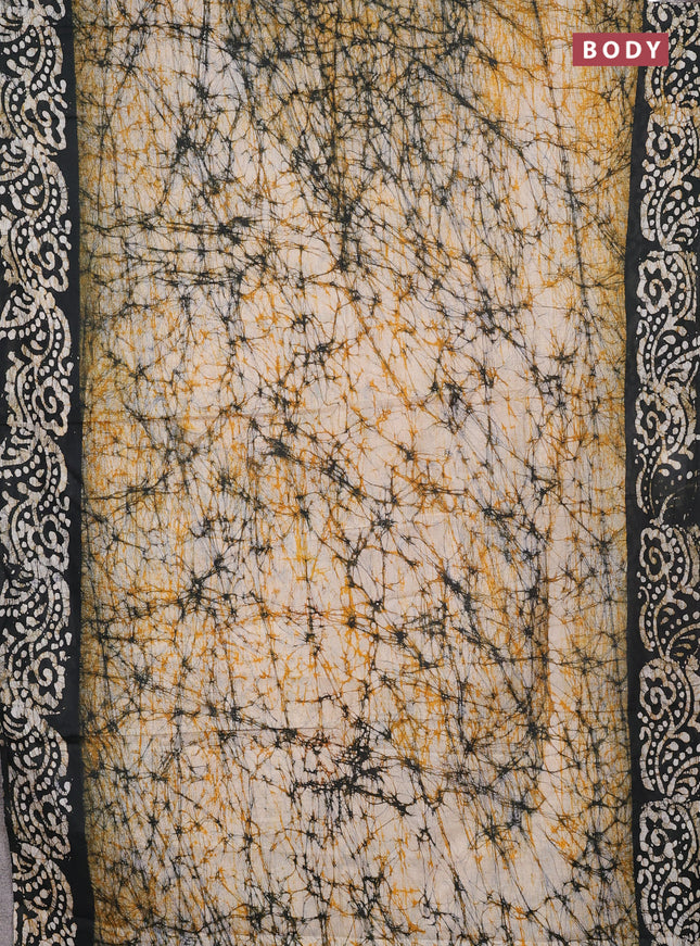 Batik cotton saree beige and black with allover prints and batik printed border