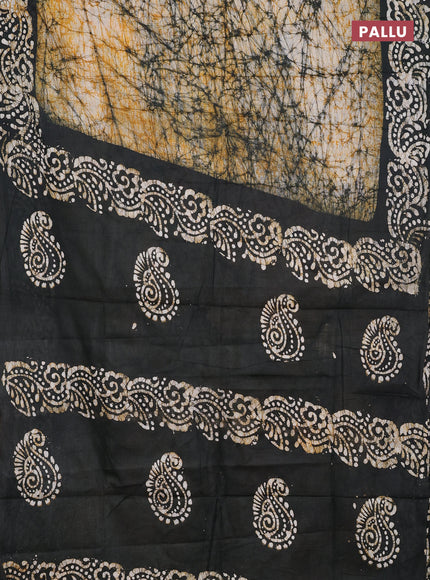 Batik cotton saree beige and black with allover prints and batik printed border