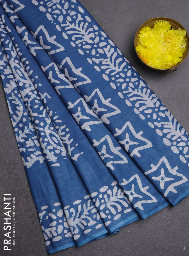 Batik cotton saree peacock blue with allover prints and batik printed border