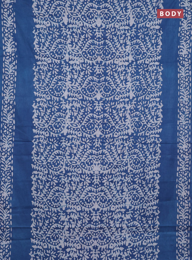 Batik cotton saree peacock blue with allover prints and batik printed border