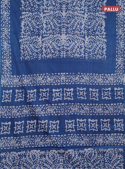 Batik cotton saree peacock blue with allover prints and batik printed border