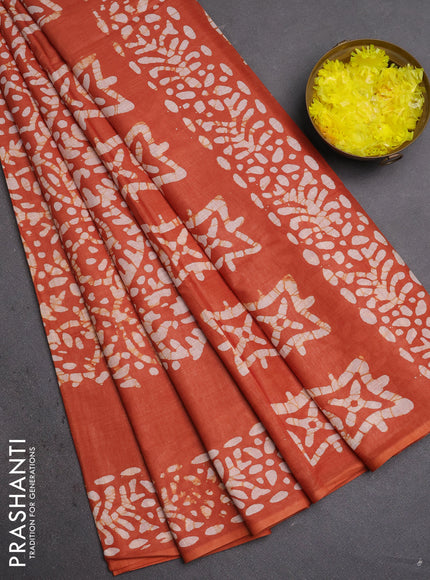 Batik cotton saree rust shade with allover prints and batik printed border
