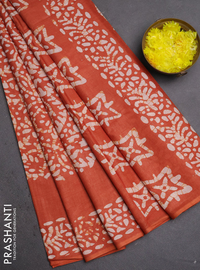 Batik cotton saree rust shade with allover prints and batik printed border