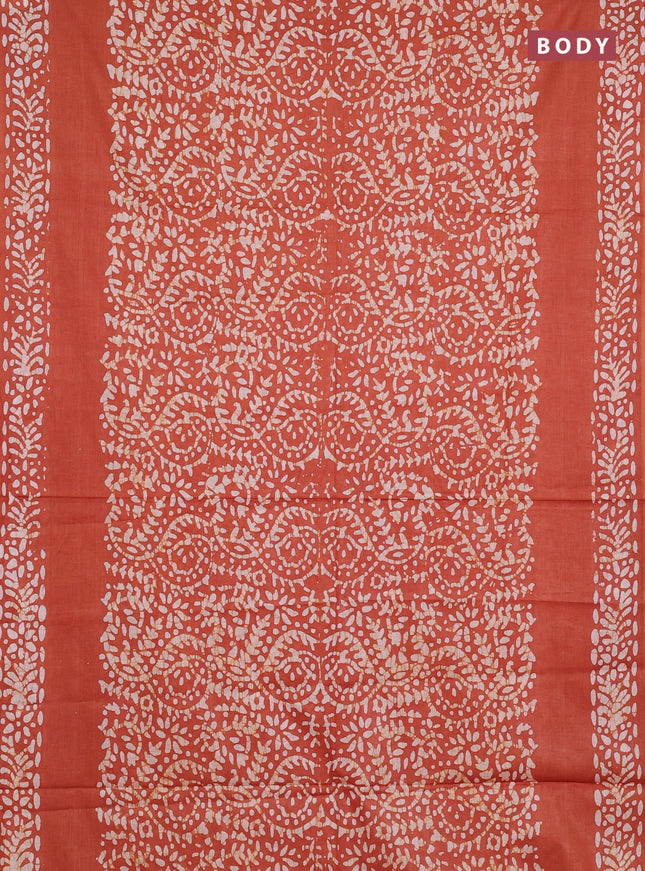 Batik cotton saree rust shade with allover prints and batik printed border