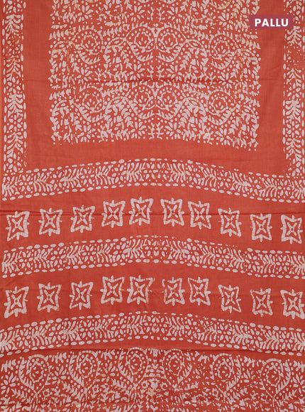 Batik cotton saree rust shade with allover prints and batik printed border
