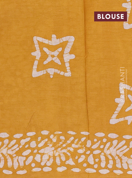 Batik cotton saree mustard yellow with allover prints and batik printed border