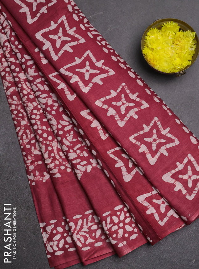 Batik cotton saree maroon with allover prints and batik printed border