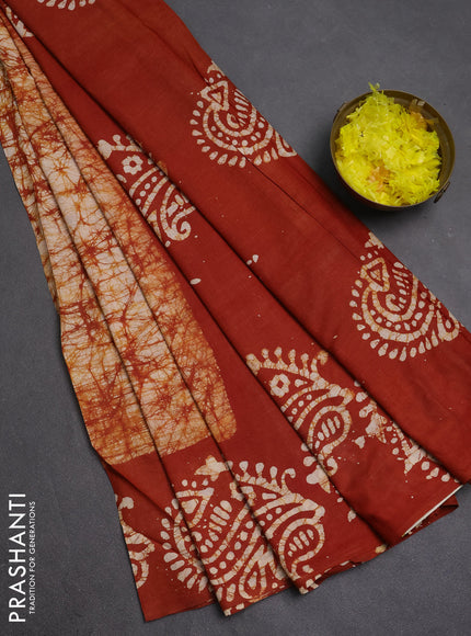 Batik cotton saree rust shade with allover prints and batik printed border