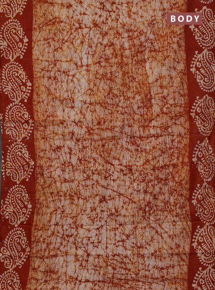 Batik cotton saree rust shade with allover prints and batik printed border