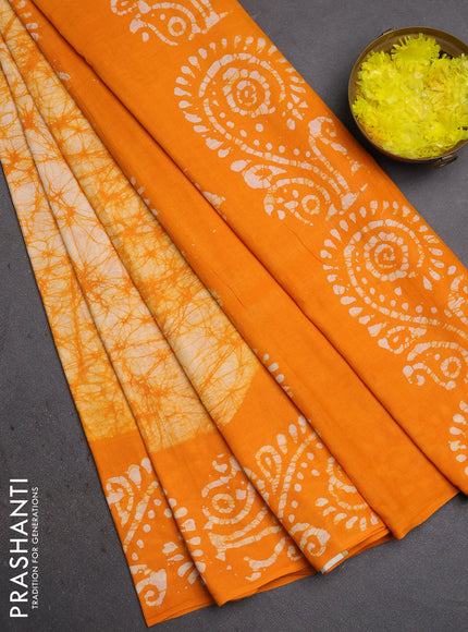 Batik cotton saree mango yellow with allover prints and batik printed border