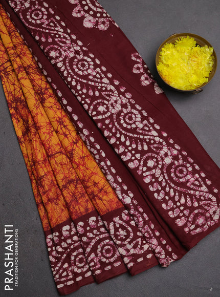 Batik cotton saree mustard yellow and wine shade with allover prints and batik printed border
