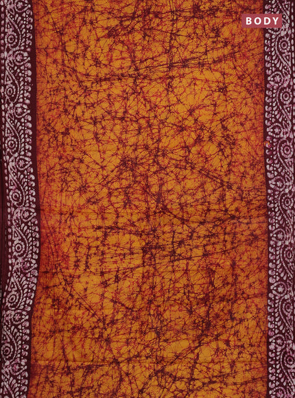 Batik cotton saree mustard yellow and wine shade with allover prints and batik printed border