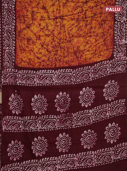 Batik cotton saree mustard yellow and wine shade with allover prints and batik printed border