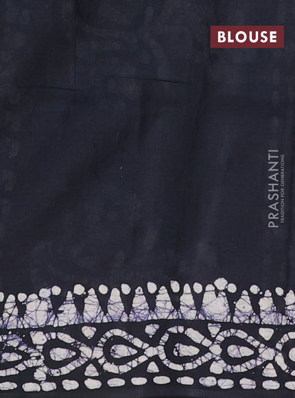 Batik cotton saree bottle green and black with allover prints and batik printed border