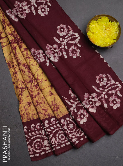 Batik cotton saree mustard yellow and wine shade with allover prints and batik printed border