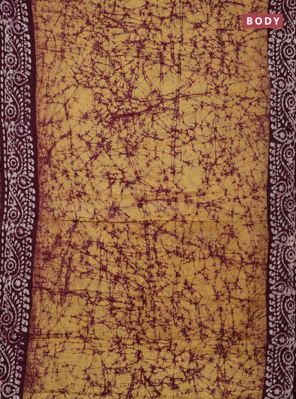 Batik cotton saree mustard yellow and wine shade with allover prints and batik printed border