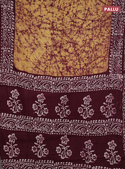 Batik cotton saree mustard yellow and wine shade with allover prints and batik printed border