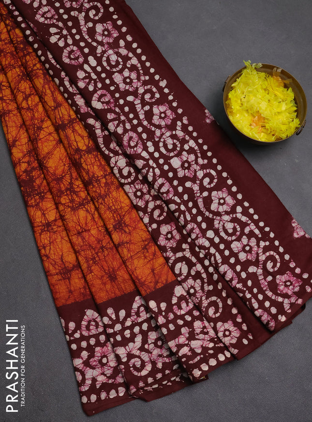 Batik cotton saree dark mustard and deep maroon with allover prints and batik printed border
