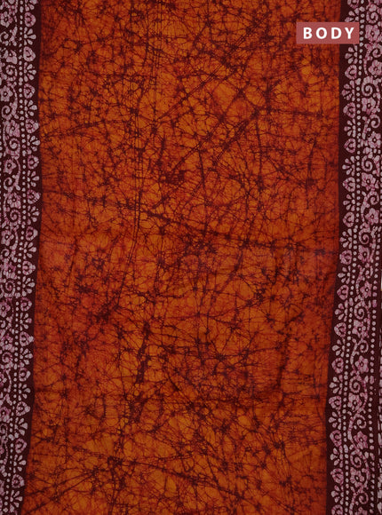 Batik cotton saree dark mustard and deep maroon with allover prints and batik printed border
