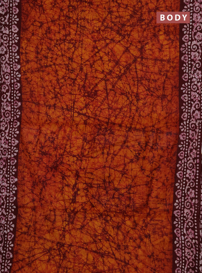 Batik cotton saree dark mustard and deep maroon with allover prints and batik printed border