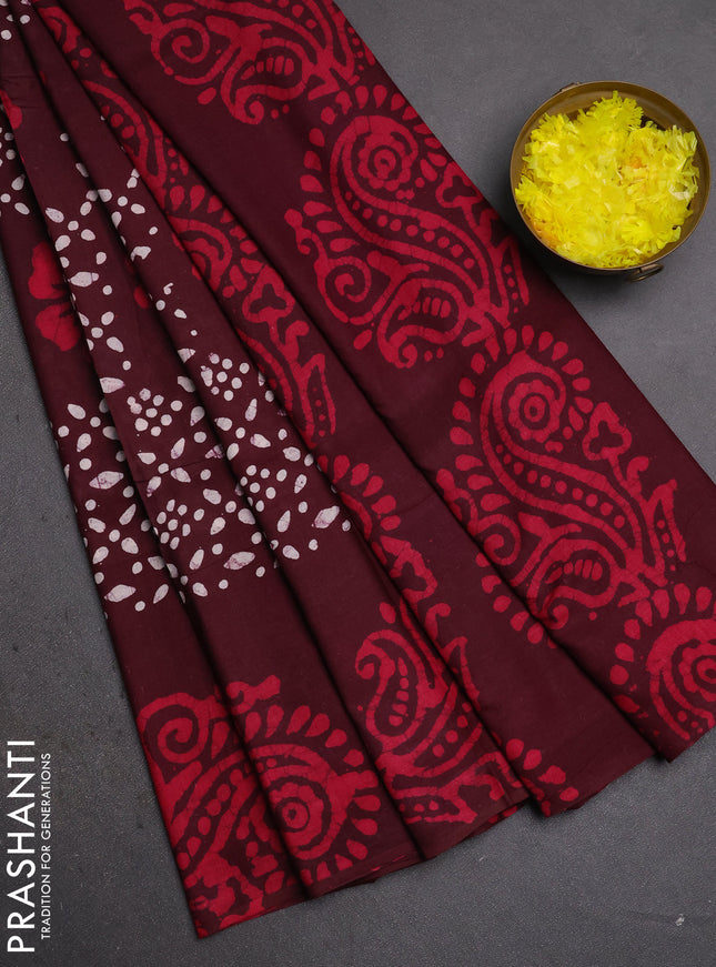 Batik cotton saree deep wine shade with allover prints and batik printed border
