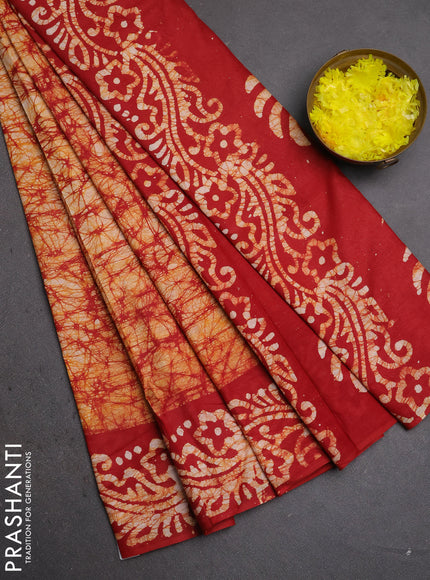 Batik cotton saree mustard yellow and red with allover prints and batik printed border