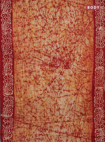 Batik cotton saree mustard yellow and red with allover prints and batik printed border